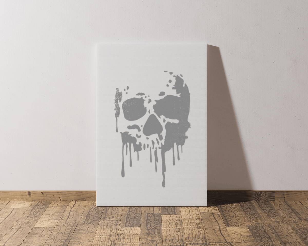 a white canvas with a skull design on it, standing on a wooden floor against a white wall.