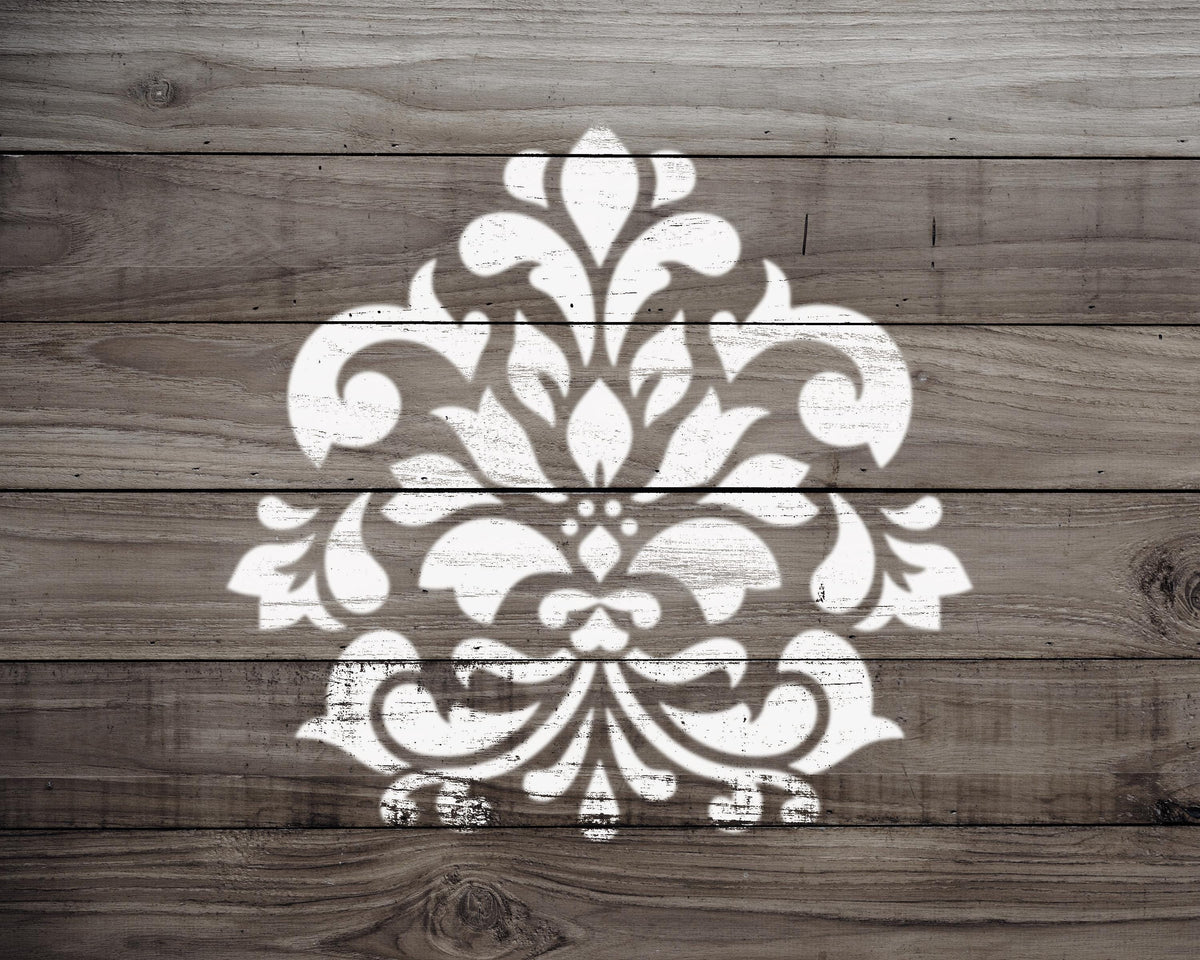 a decorative white pattern painted on a wooden surface.