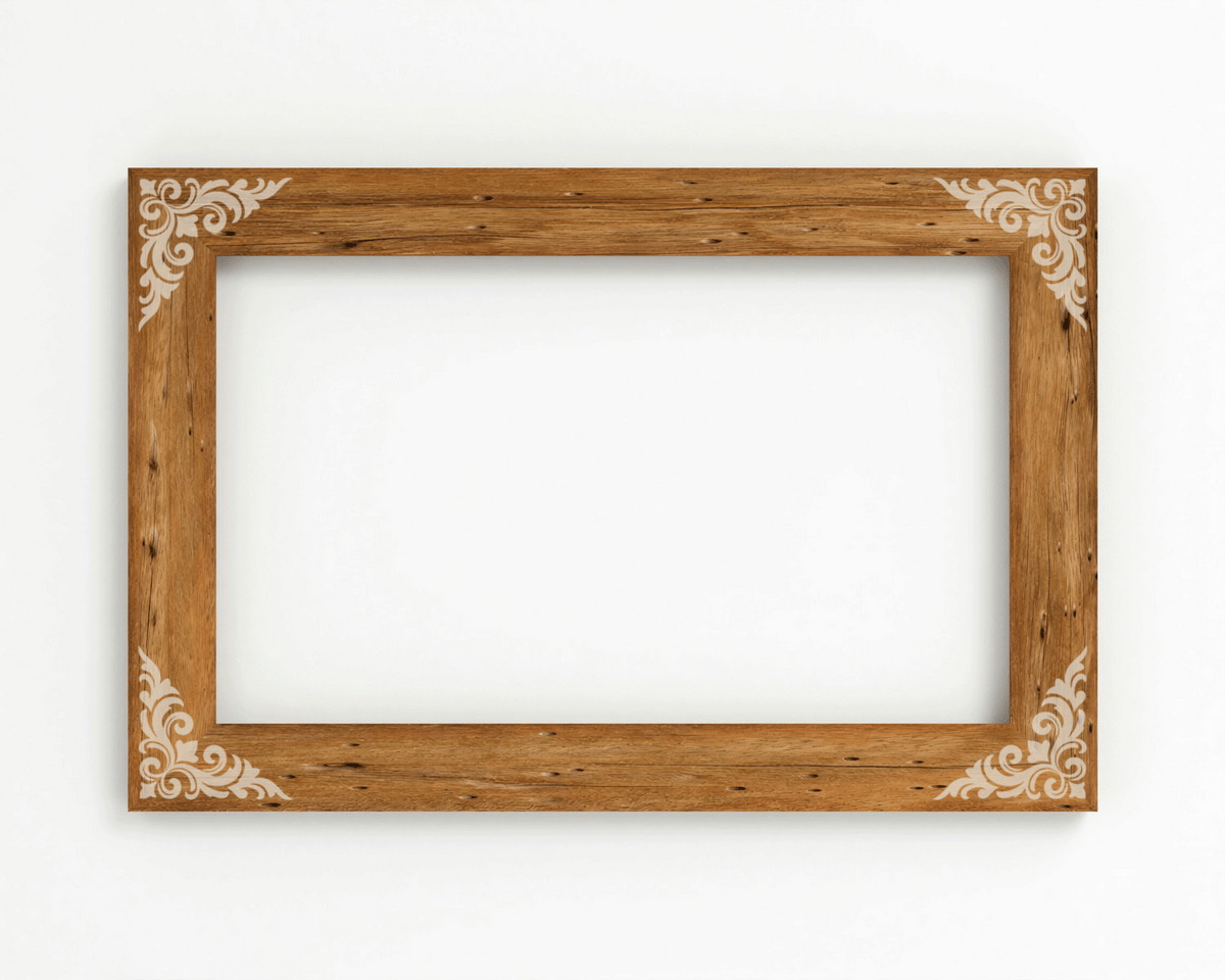 A wooden picture frame with a decorative border, placed on a white wall.