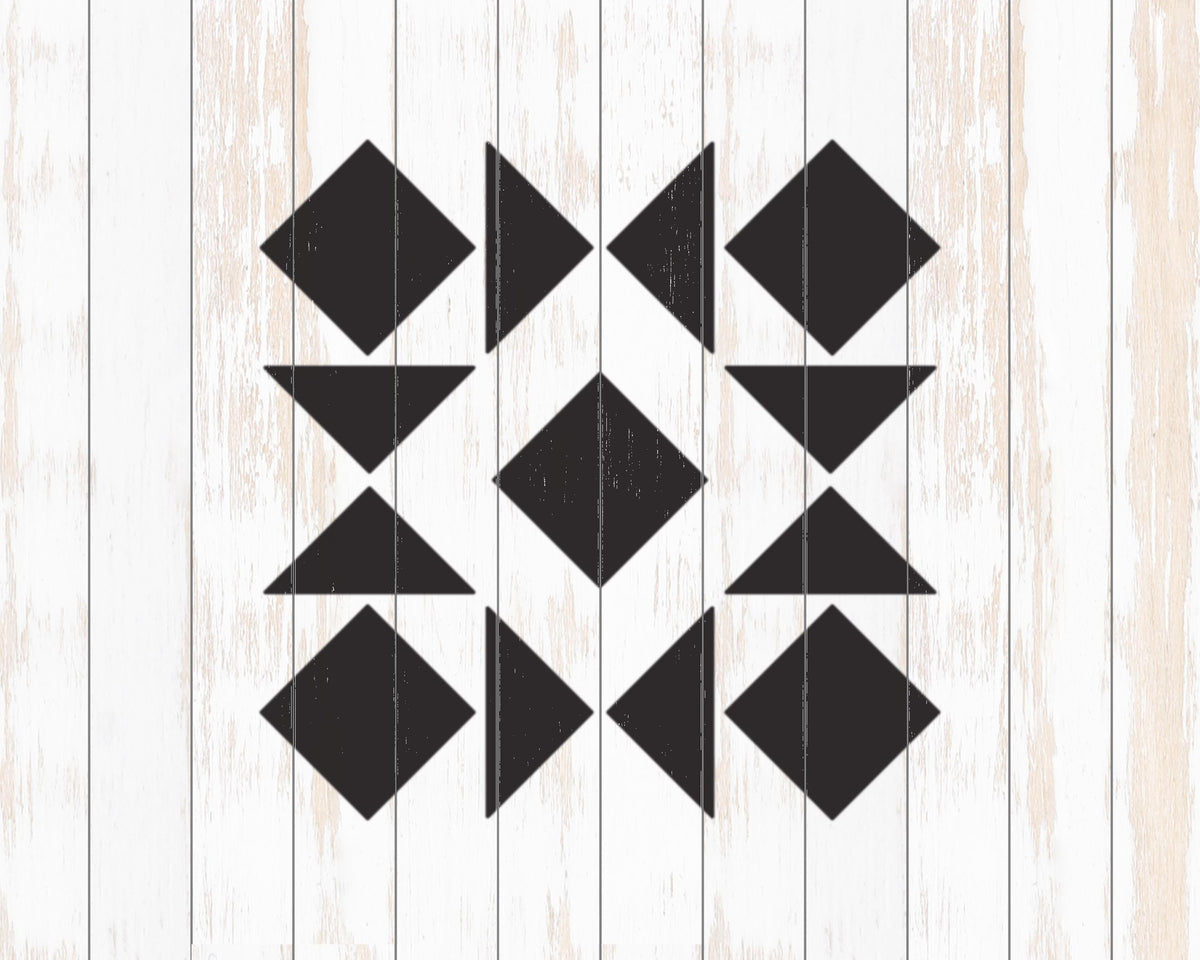 a geometric pattern composed of black triangles arranged in a repeating pattern on a white wooden background.