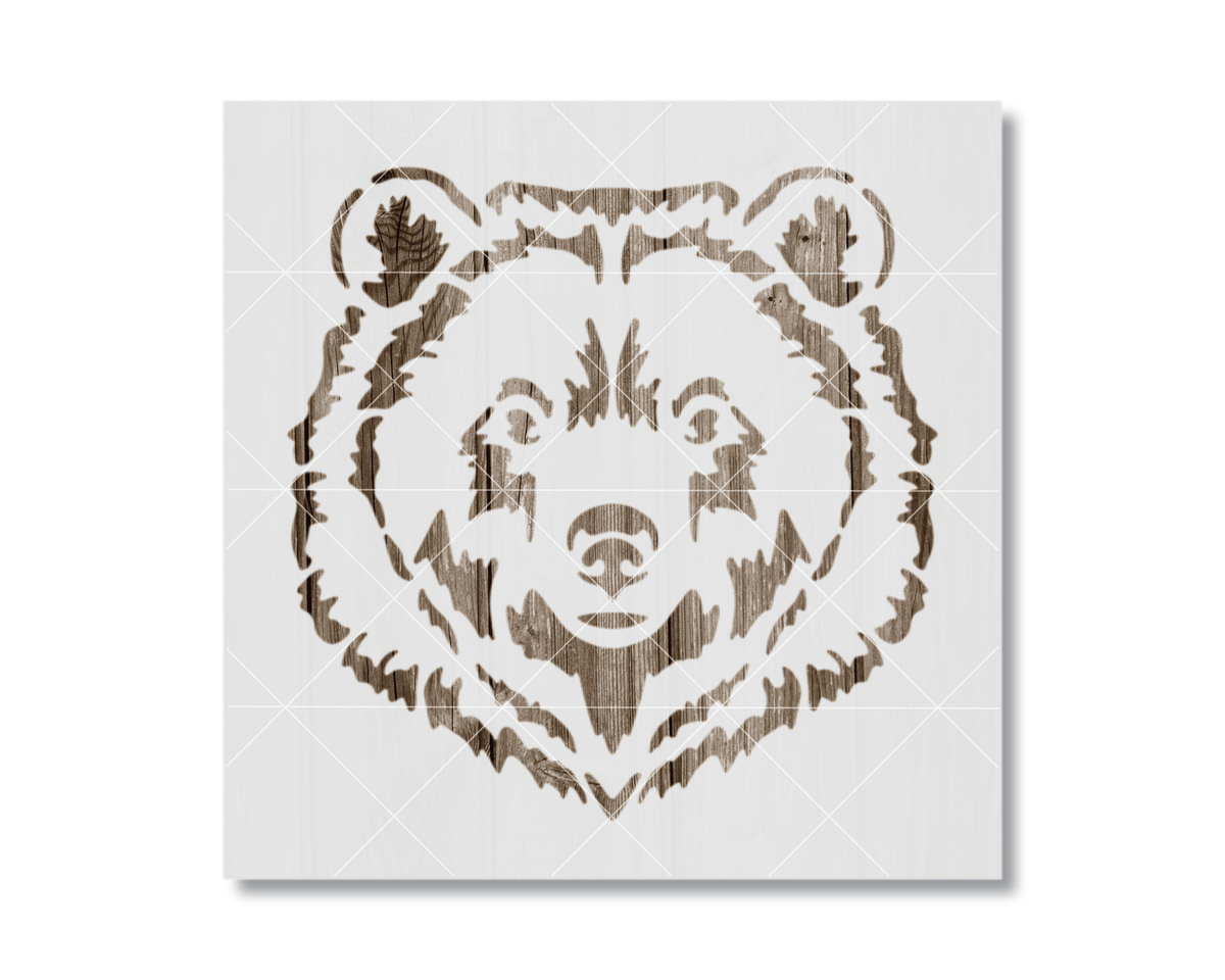 A stylized bear head stencil design on a white background.