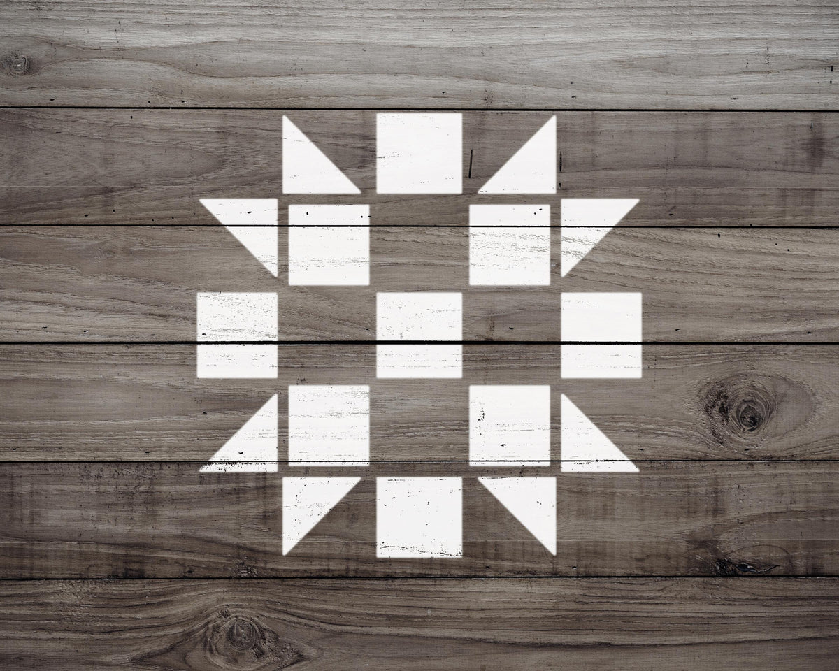 a wooden surface with a white geometric pattern composed of various shapes, including squares and triangles, creating a visually striking design.