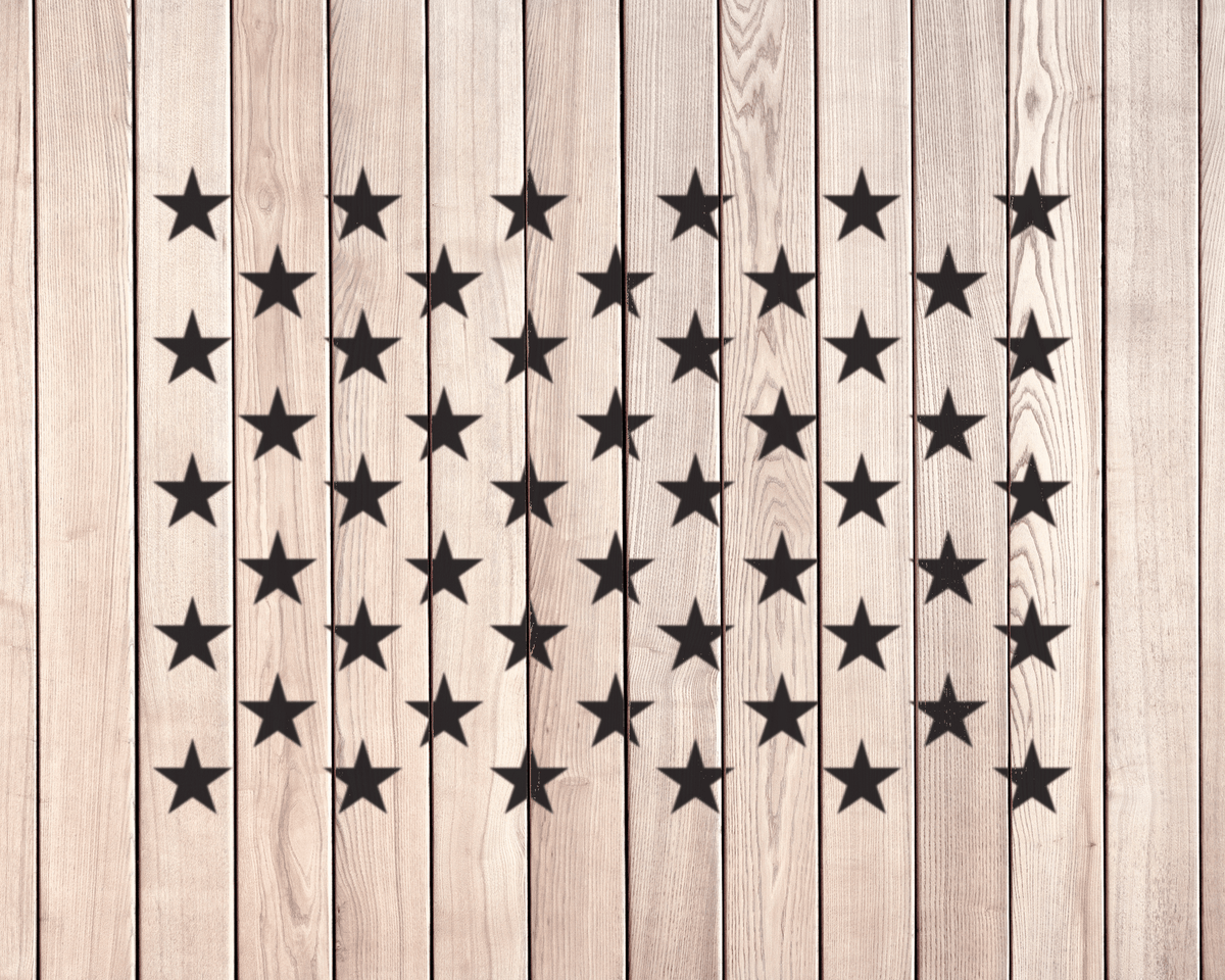 a wooden background with a repeating pattern of black stars arranged in a grid-like fashion.