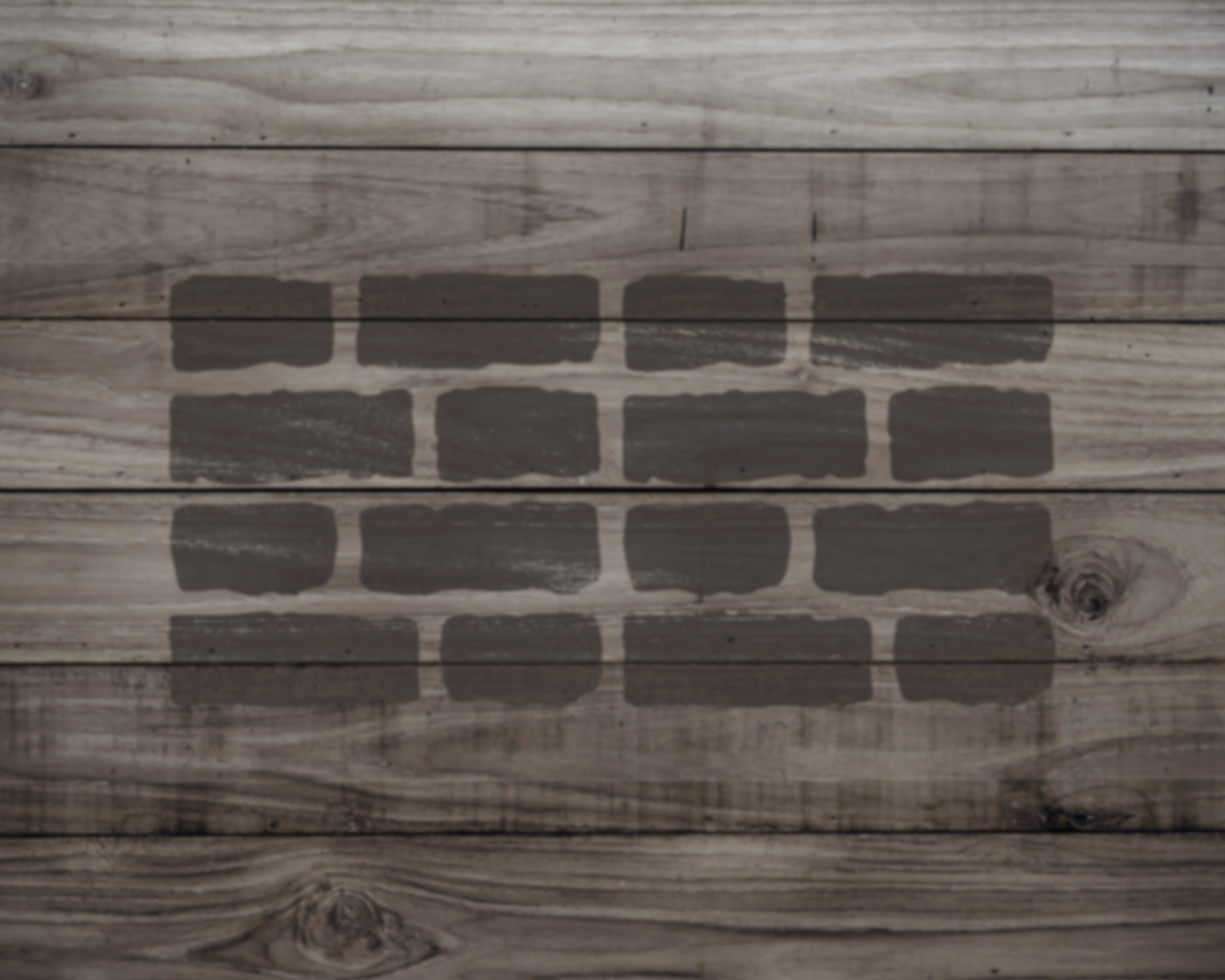 a wooden surface with a pattern of dark gray bricks or blocks arranged in a repeating pattern.