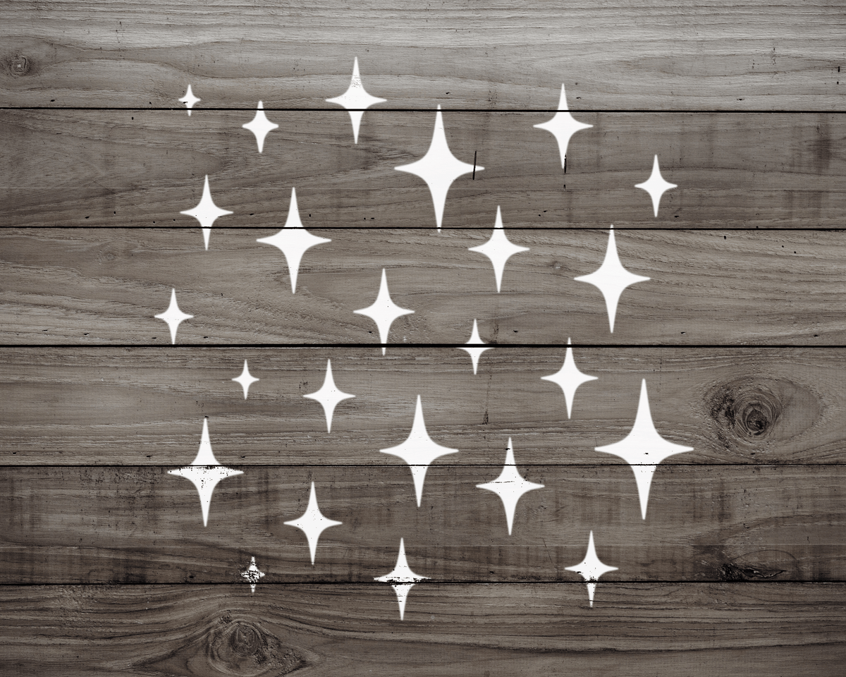 a wooden surface with white star-shaped designs scattered across it.