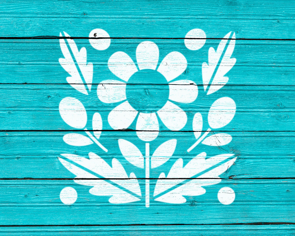 a blue wooden surface with a white floral design in the center.