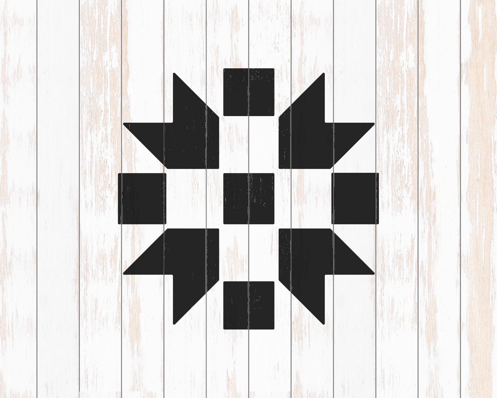 a black and white geometric design composed of various shapes and patterns, including squares, triangles, and other geometric elements, all set against a white wooden background.