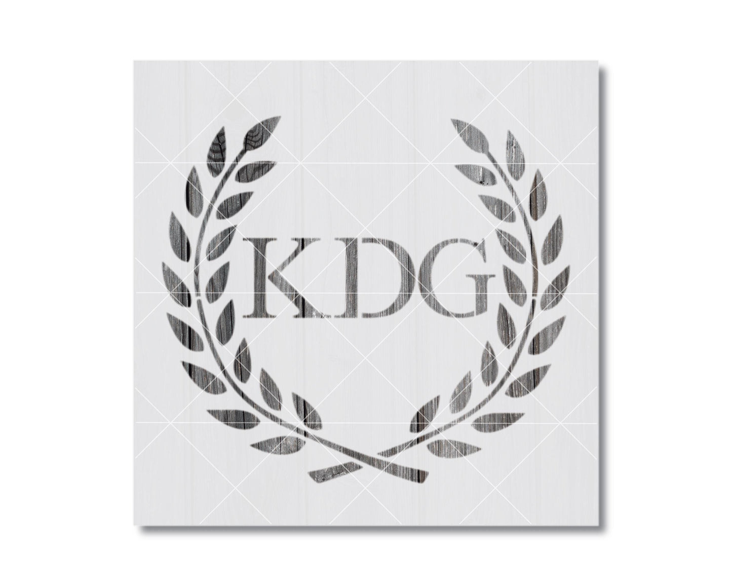 a monogrammed logo with the letters "KDG" prominently displayed in the center.