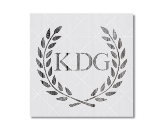 a monogrammed logo with the letters "KDG" prominently displayed in the center.