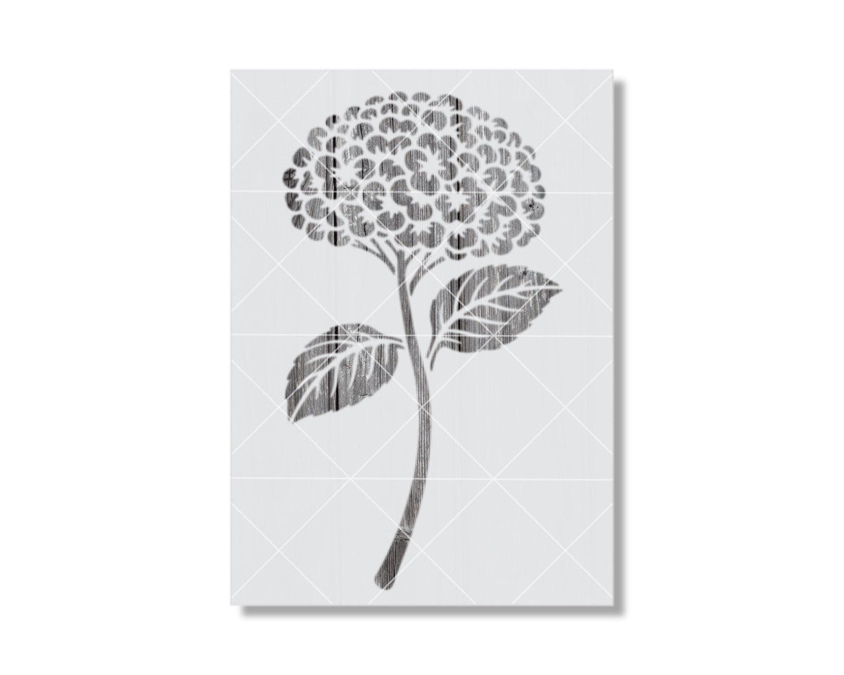 A black and white illustration of a flower with a large central bloom and two smaller leaves.