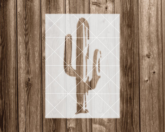 a wooden background with a white stencil of a cactus in the center.