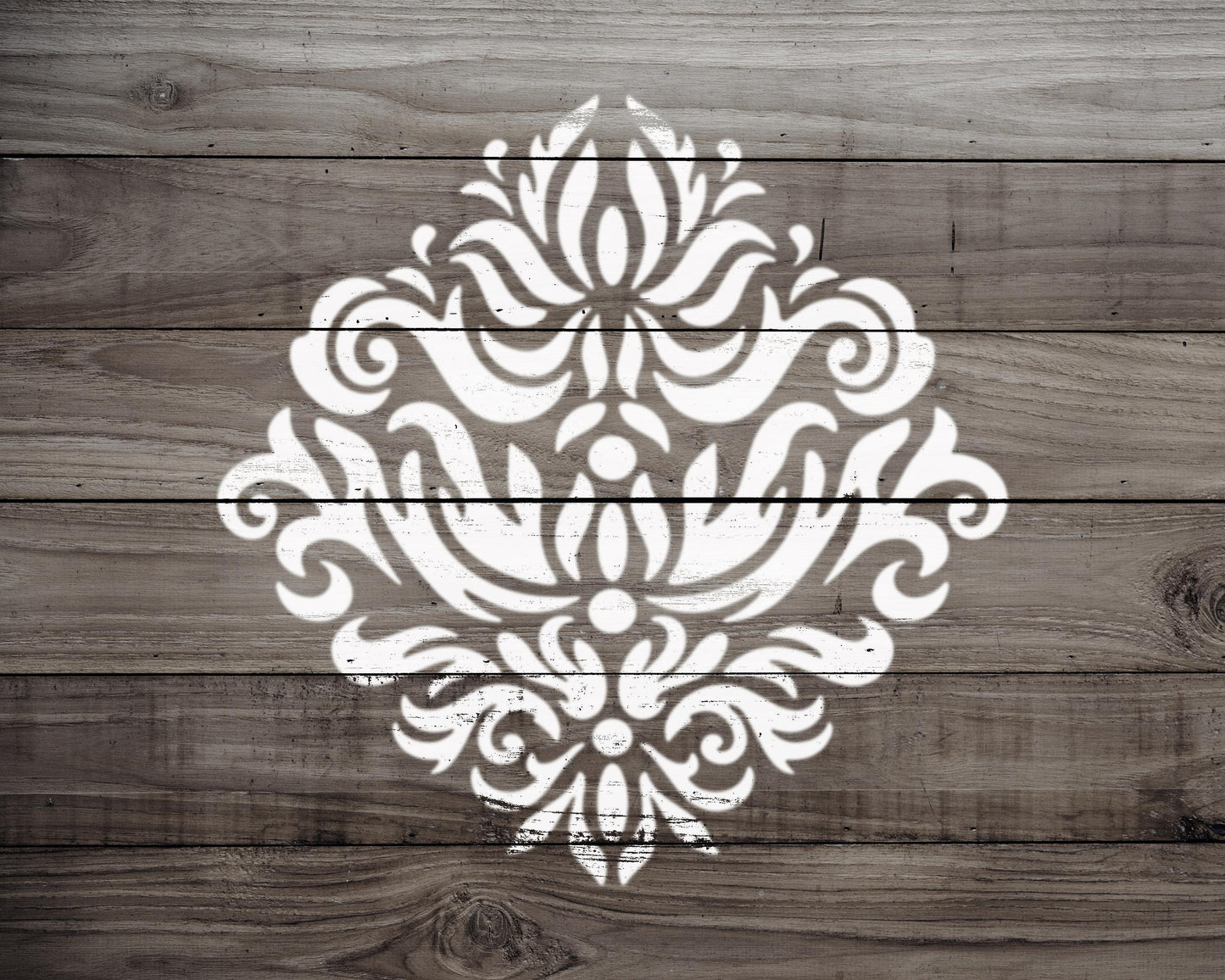 a decorative white pattern on a wooden background.