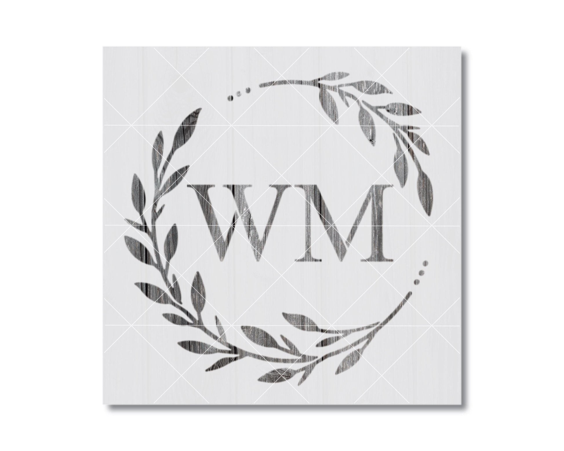 a monogrammed wreath with the initials 'WM' prominently displayed in the center.