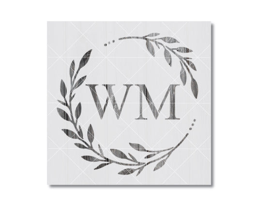 a monogrammed wreath with the initials 'WM' prominently displayed in the center.