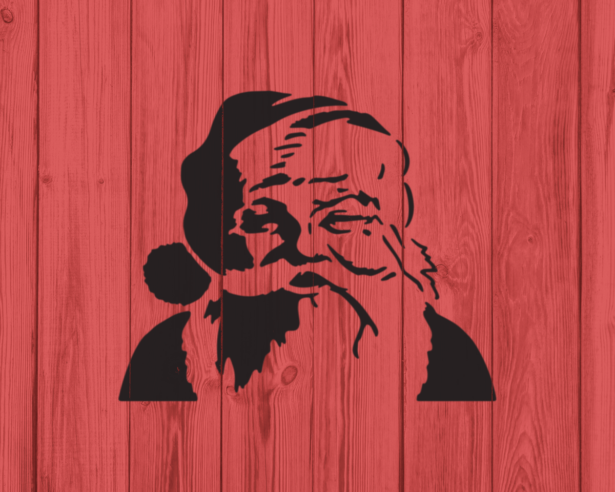 A silhouette of a person's face, likely Santa Claus, against a red wooden background.