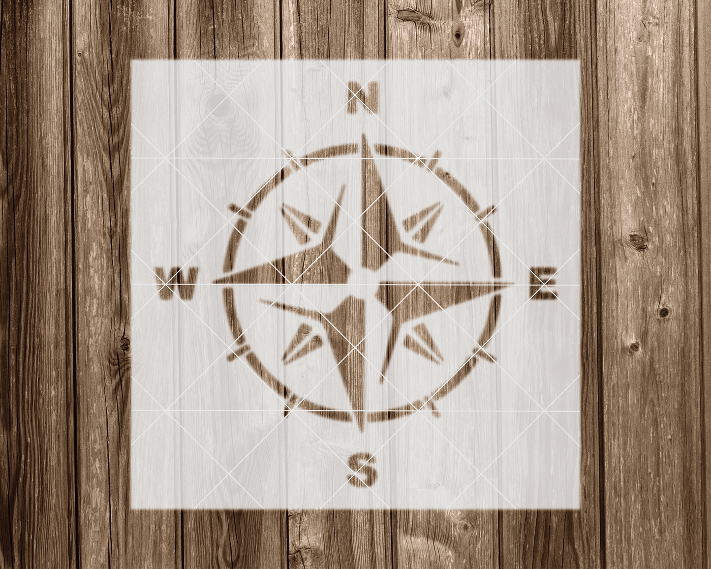 a wooden wall with a compass on it