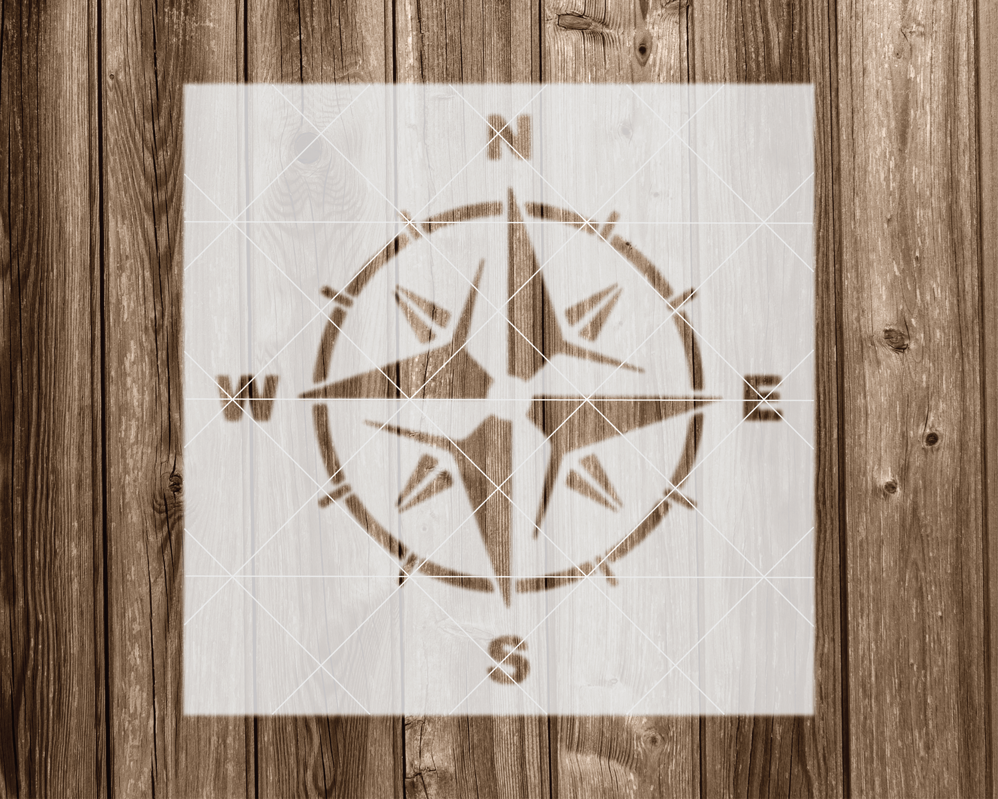 a wooden wall with a compass on it