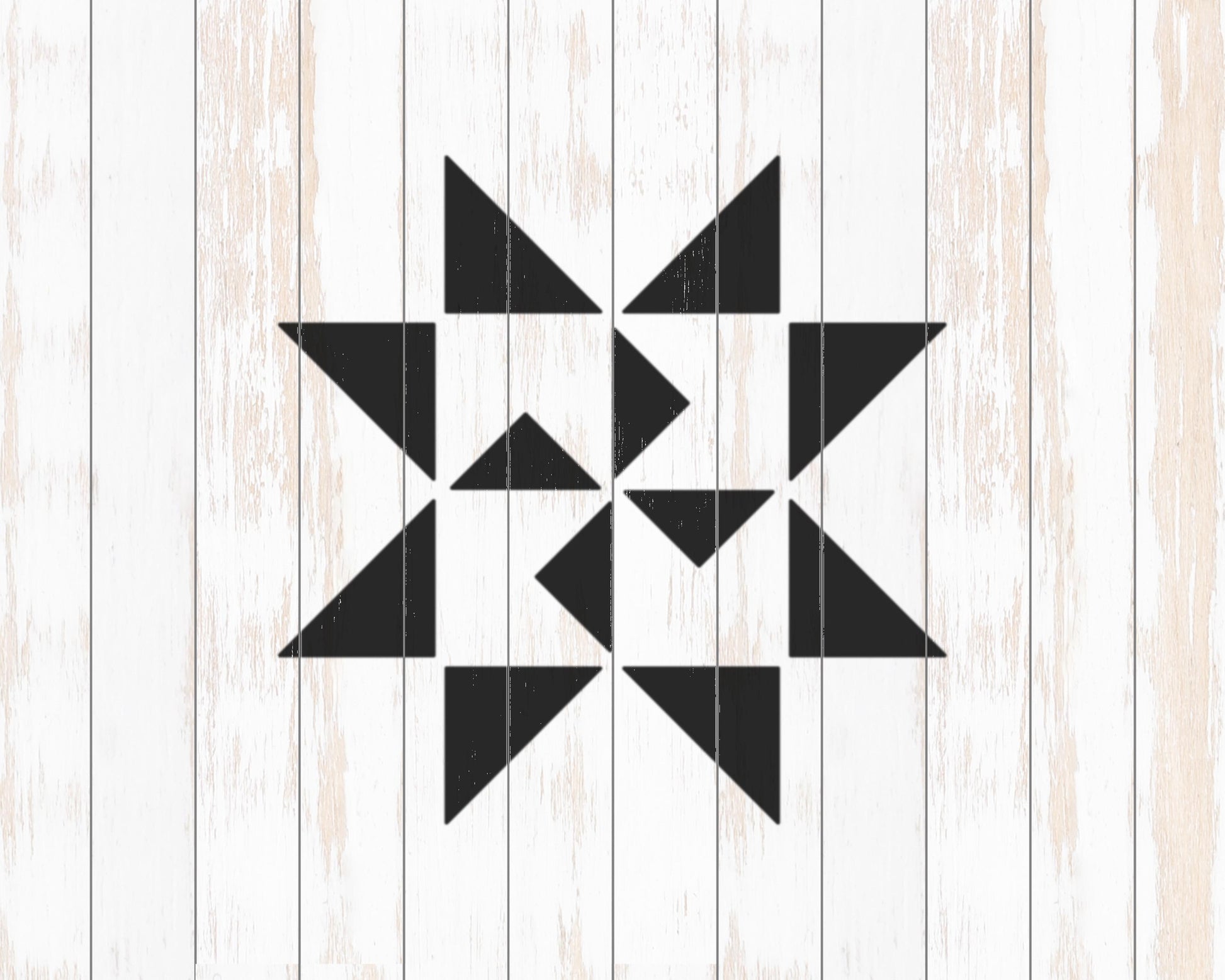 a black and white geometric design composed of various triangular shapes arranged in a symmetrical pattern.
