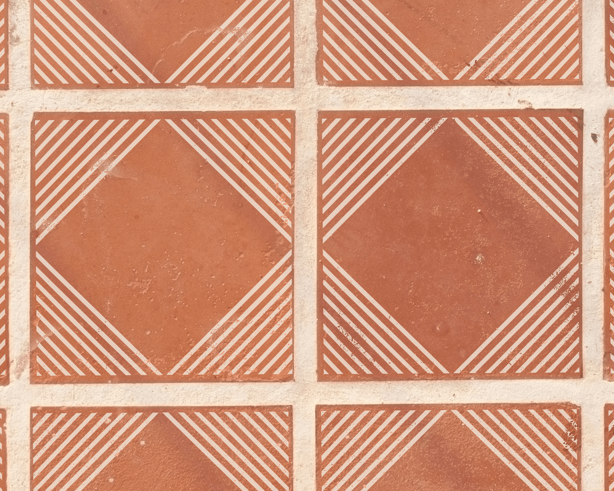 a repeating pattern of orange and white geometric shapes, creating a visually striking and symmetrical design.