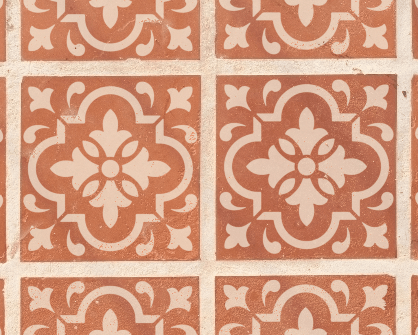 a repeating pattern of ornate, symmetrical designs in shades of brown and white. The pattern consists of a series of square tiles arranged in a grid-like fashion, with each tile showcasing a unique design. The tiles are arranged in a way that creates a visually striking and intricate pattern, with the use of color and design elements adding depth and complexity to the overall composition.