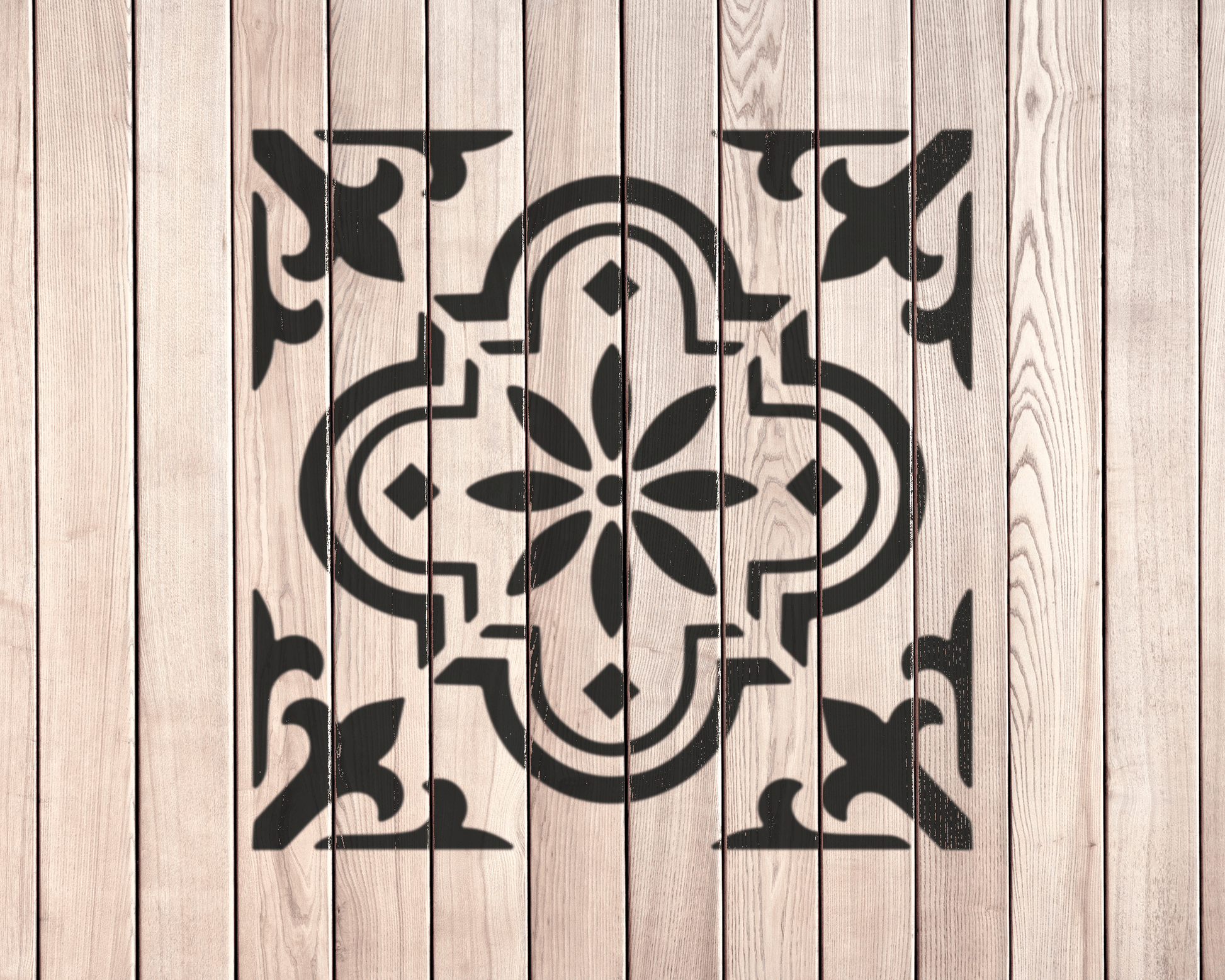 a wooden surface with a decorative black and white design in the center.