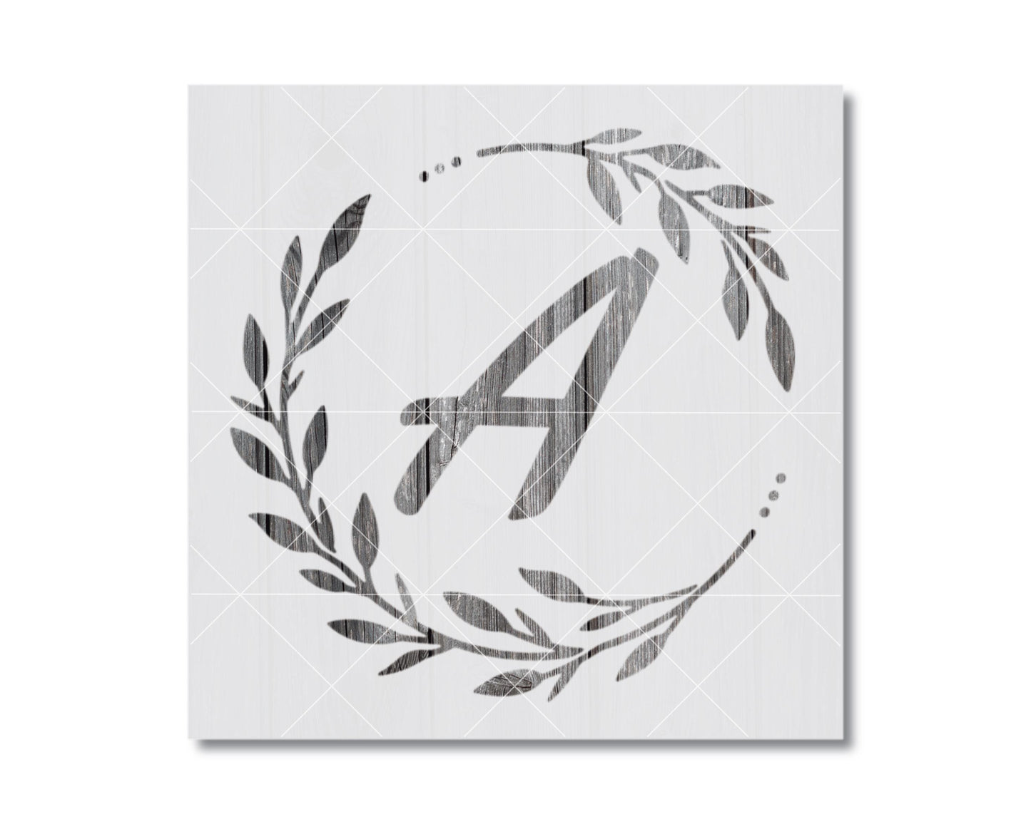 A monochromatic image featuring a stylized letter 'A' surrounded by a wreath of leaves and branches.
