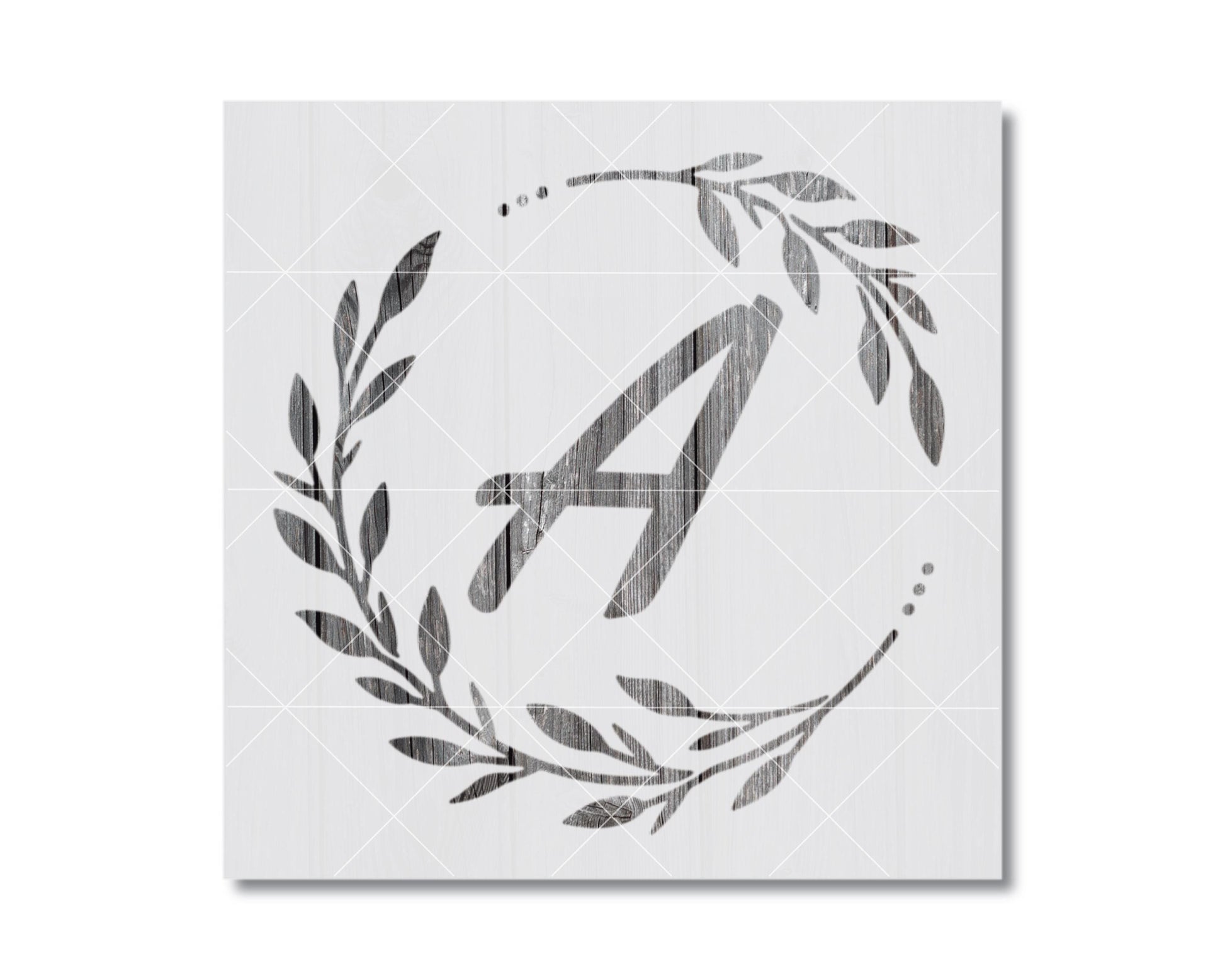 A monochromatic image featuring a stylized letter 'A' surrounded by a wreath of leaves and branches.