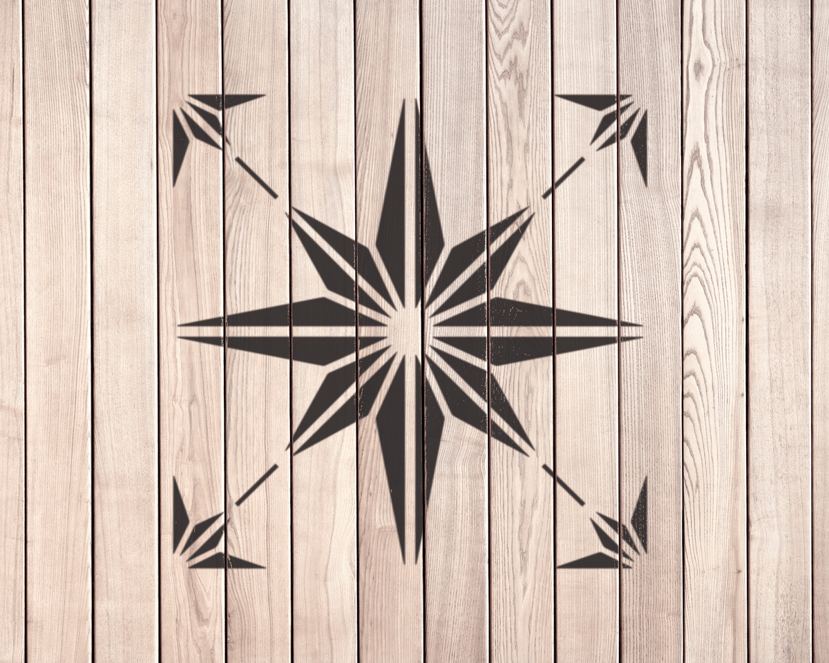 a wooden wall with a black star-shaped design in the center.