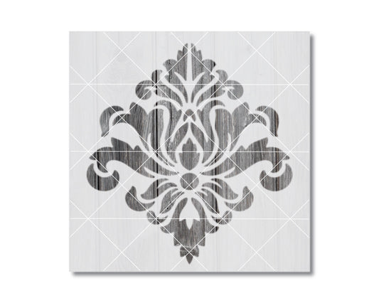 a decorative black and white design with a symmetrical pattern of floral or leaf-like shapes.