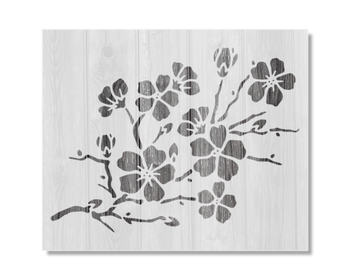 A black and white image depicting a stylized floral design on a wooden background.