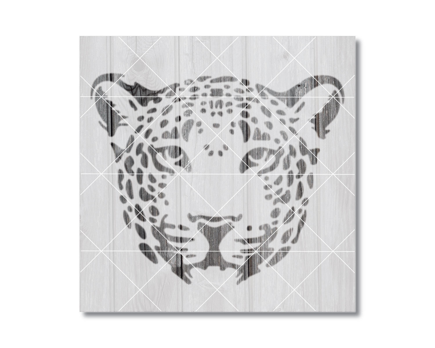 A black and white image depicting the head of a leopard, with its distinctive spotted pattern.