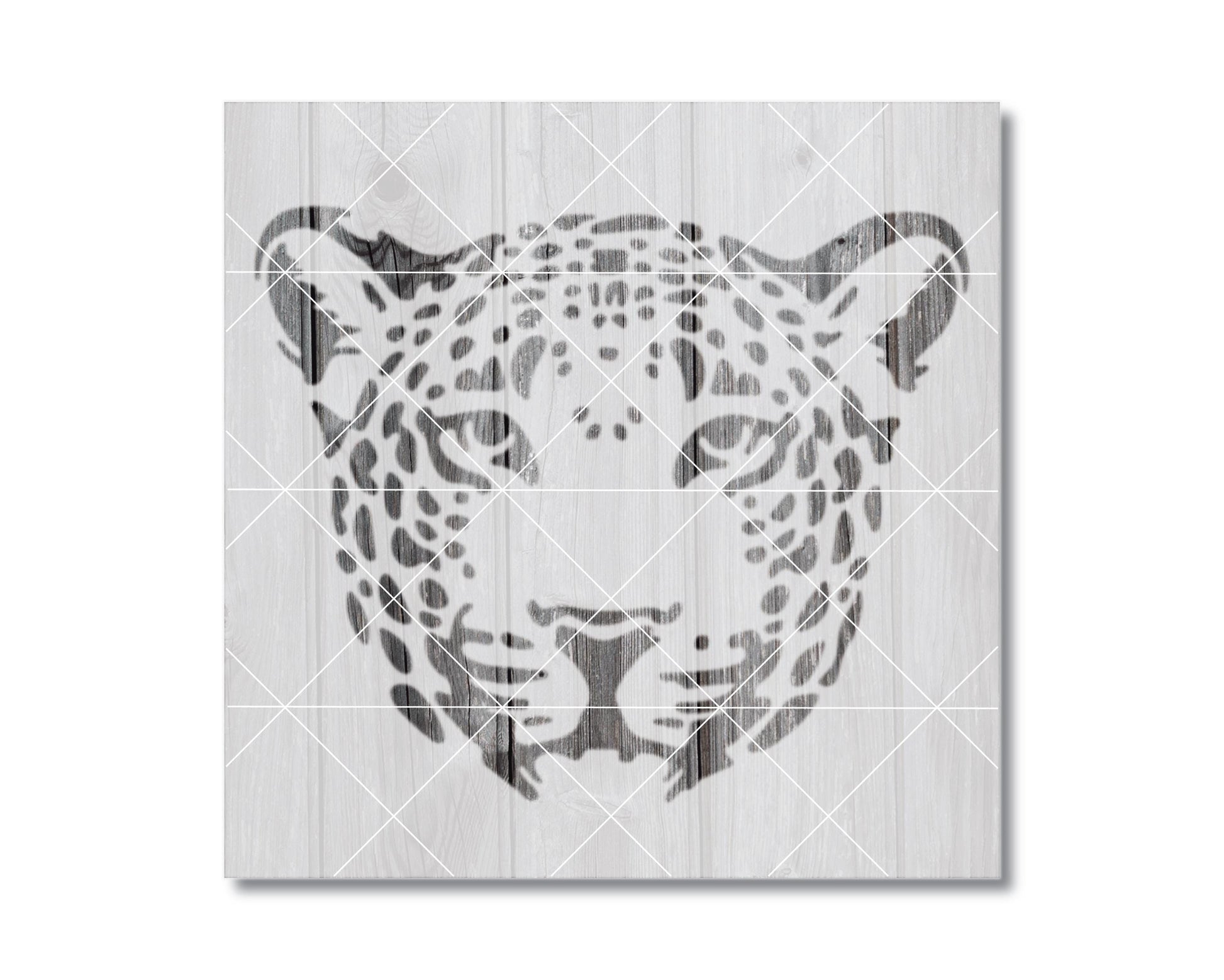 A black and white image depicting the head of a leopard, with its distinctive spotted pattern.