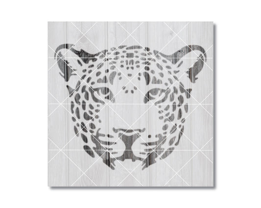 A black and white image depicting the head of a leopard, with its distinctive spotted pattern.