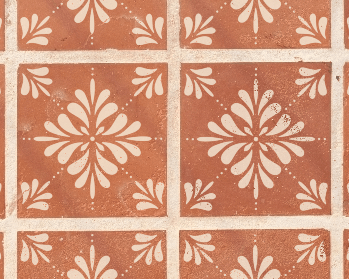 a pattern of red and white tiles arranged in a grid-like design, with a repeating floral motif.