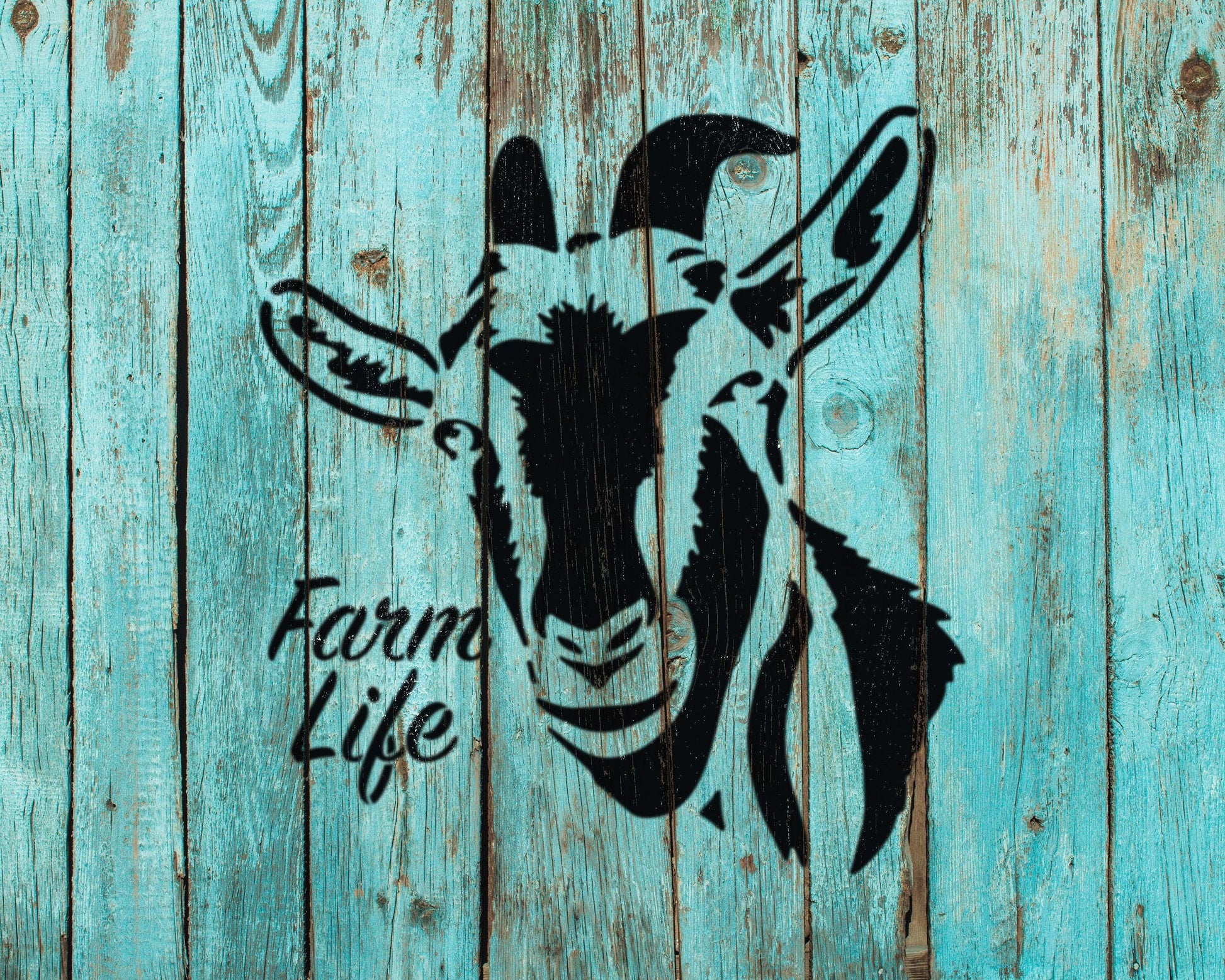 a black silhouette of a goat's head against a blue wooden background.