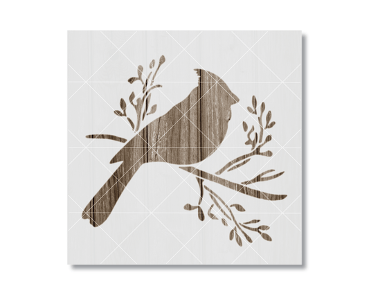 A silhouette of a bird perched on a branch with leaves and twigs.