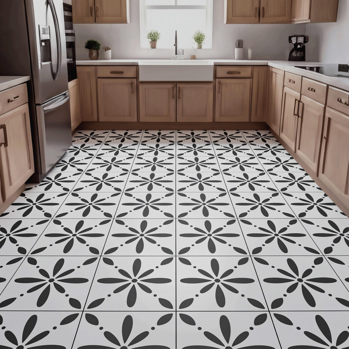 a modern kitchen with a black and white tile floor featuring a repeating pattern of stylized flowers. The kitchen is equipped with wooden cabinets and stainless steel appliances, including a refrigerator, oven, and sink.
