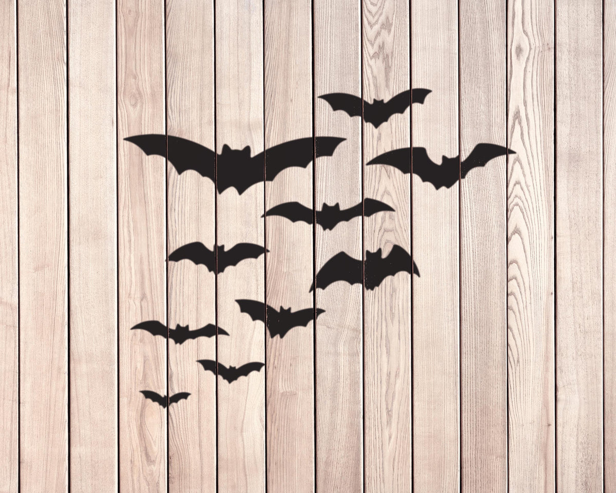 silhouettes of bats against a wooden background.