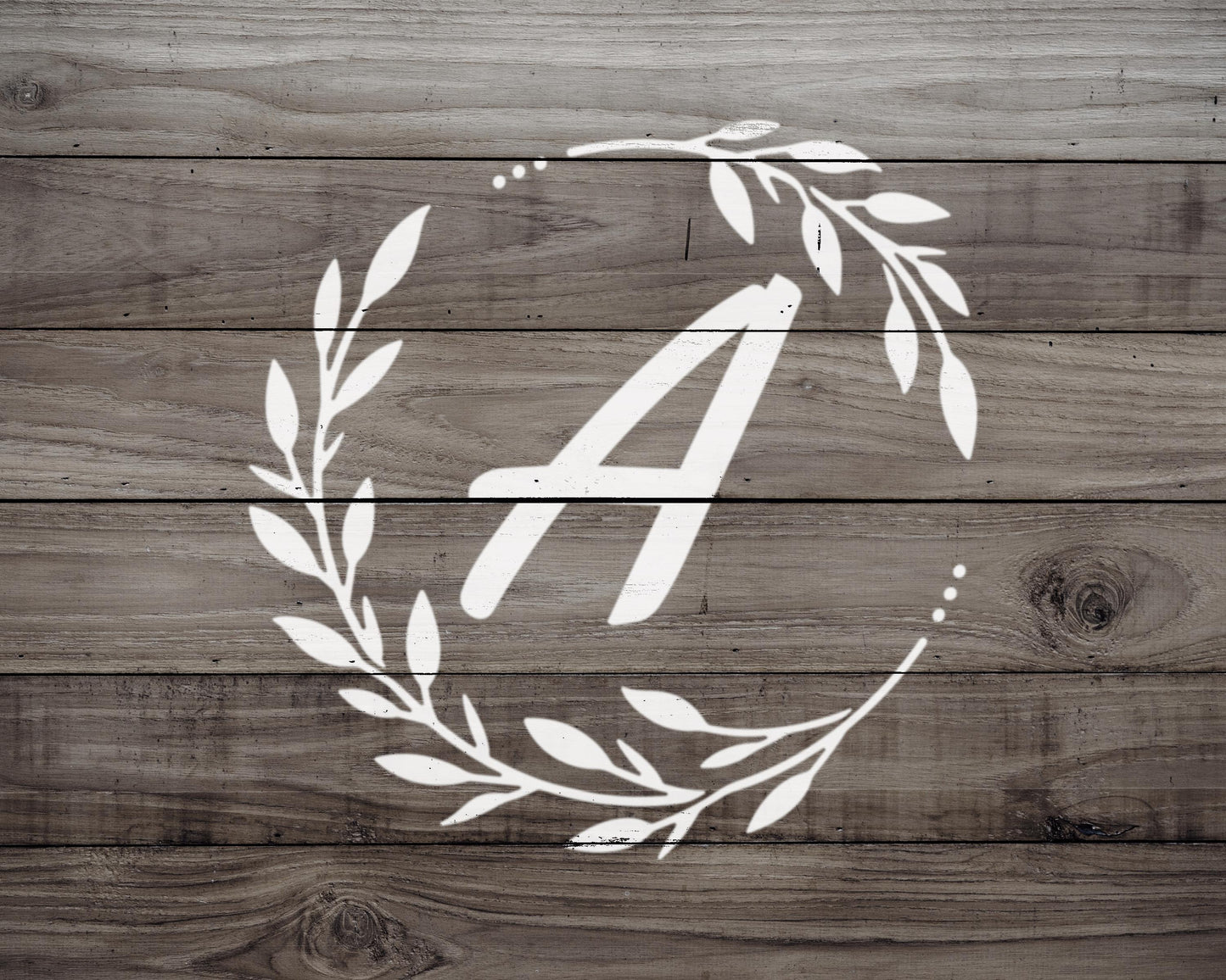 a monogrammed letter "A" on a wooden background.