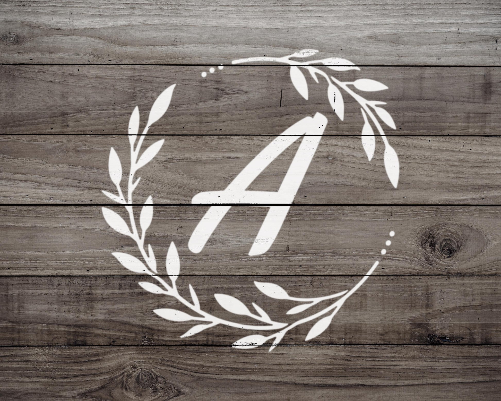 a monogrammed letter "A" on a wooden background.