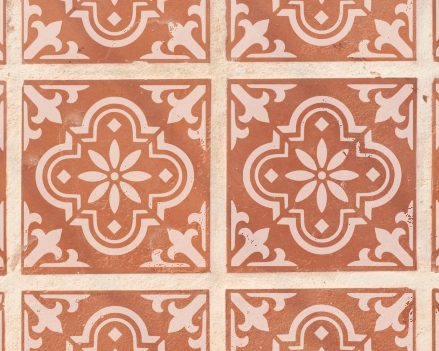 a repeating pattern of ornate, symmetrical tile designs in shades of brown and white.