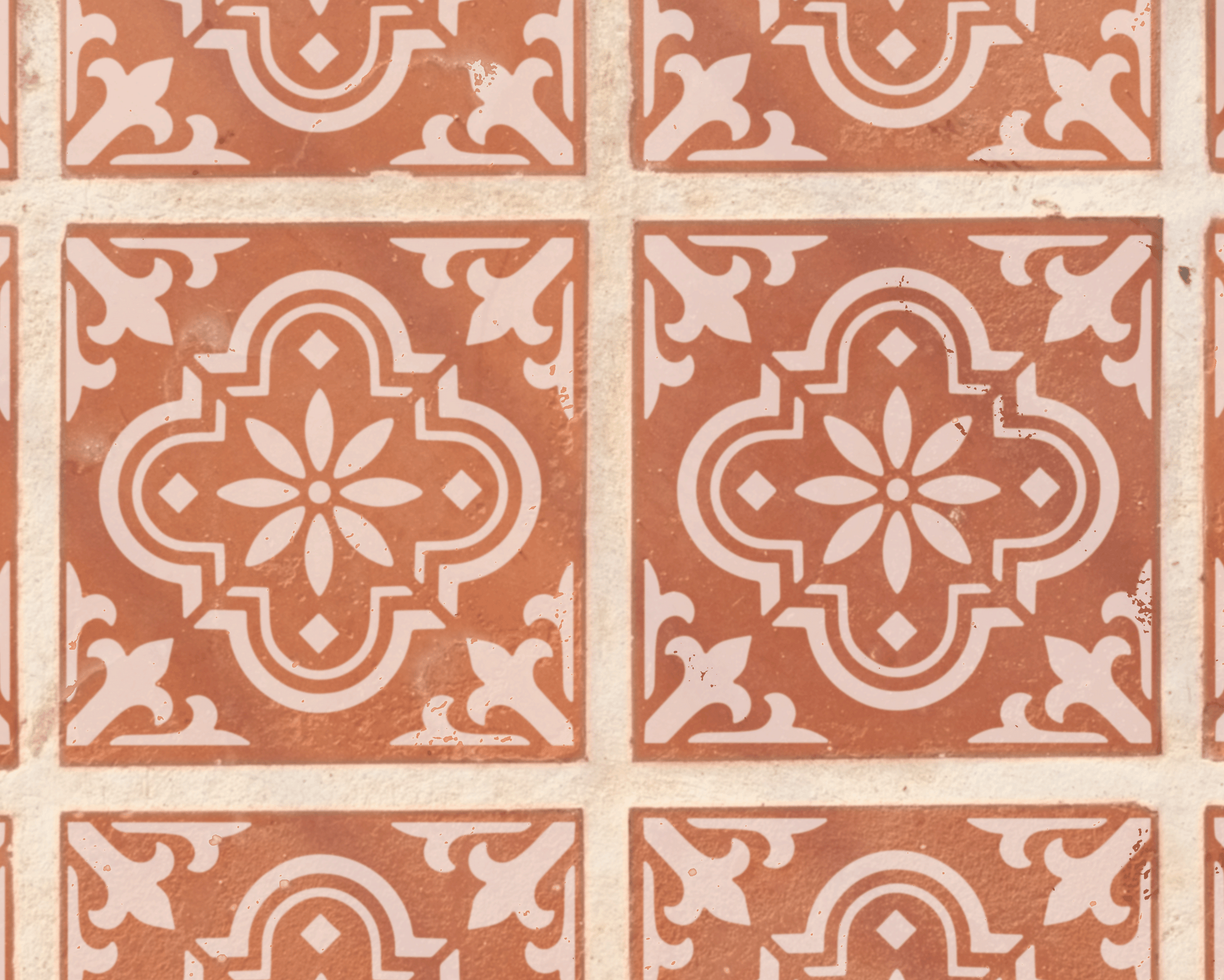 a repeating pattern of ornate, symmetrical tile designs in shades of brown and white.