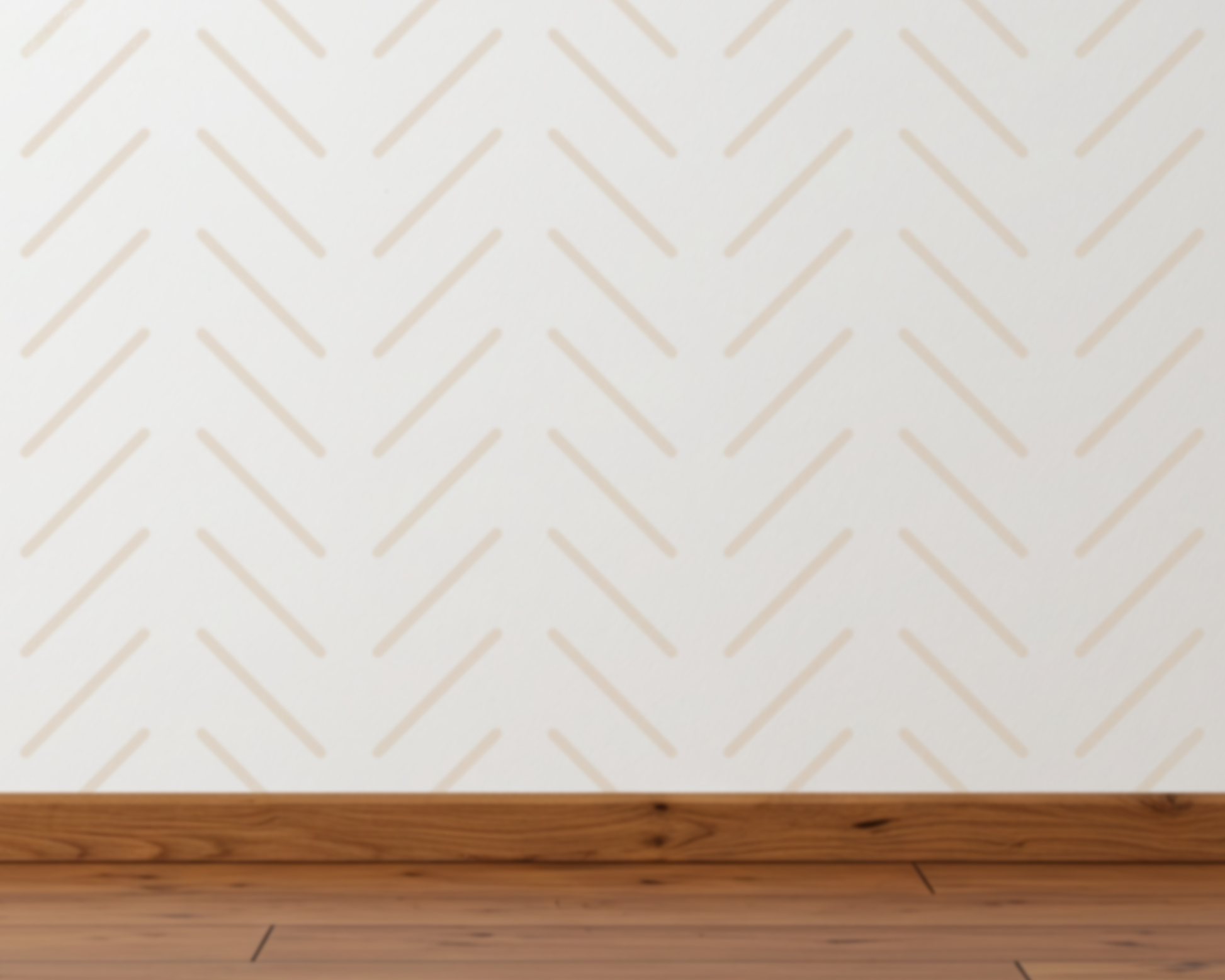 a wooden floor and a white wall with a repeating diagonal pattern of lines.