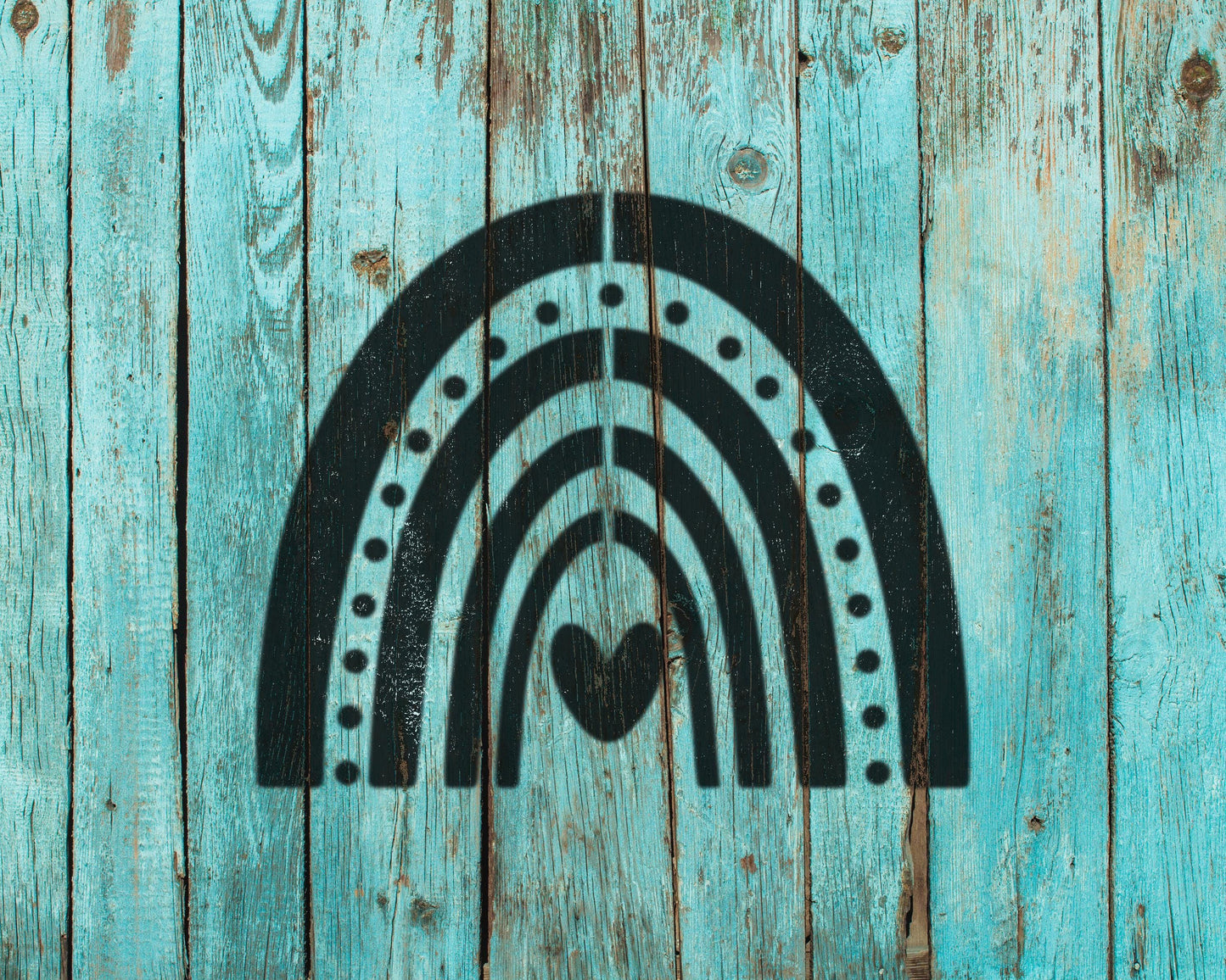 a black silhouette of a rainbow with a heart symbol in the center, set against a weathered blue wooden background.