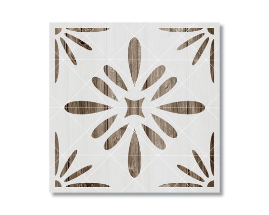 a square with a floral pattern made up of wooden shapes, including a star and leaves, arranged in a symmetrical design.
