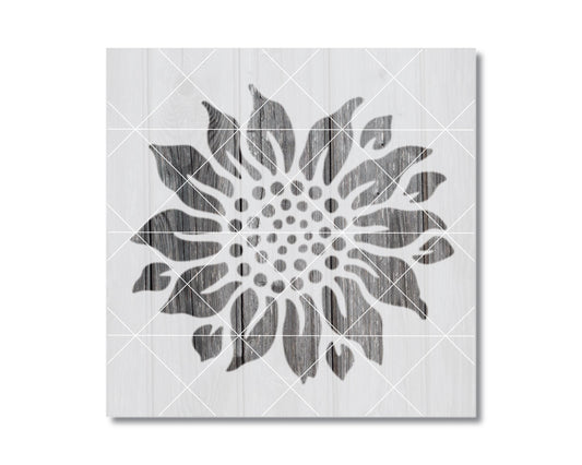 A black and white image of a stylized sunflower design on a white background.