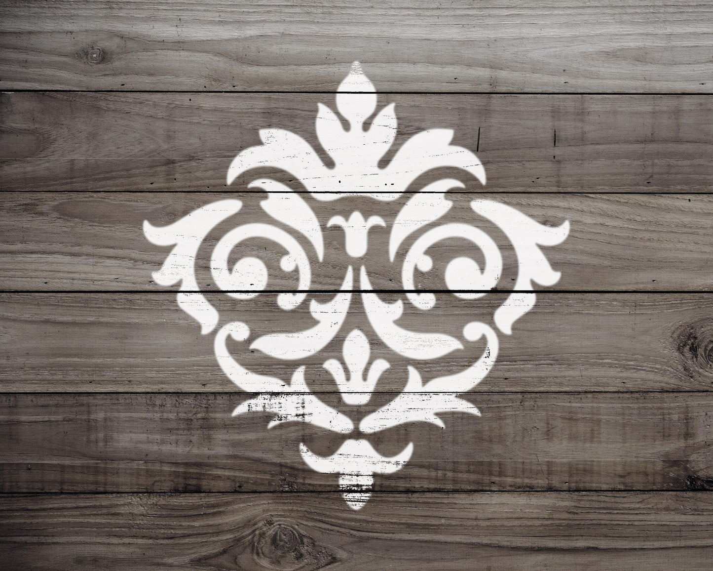 a decorative white pattern painted on a wooden surface.