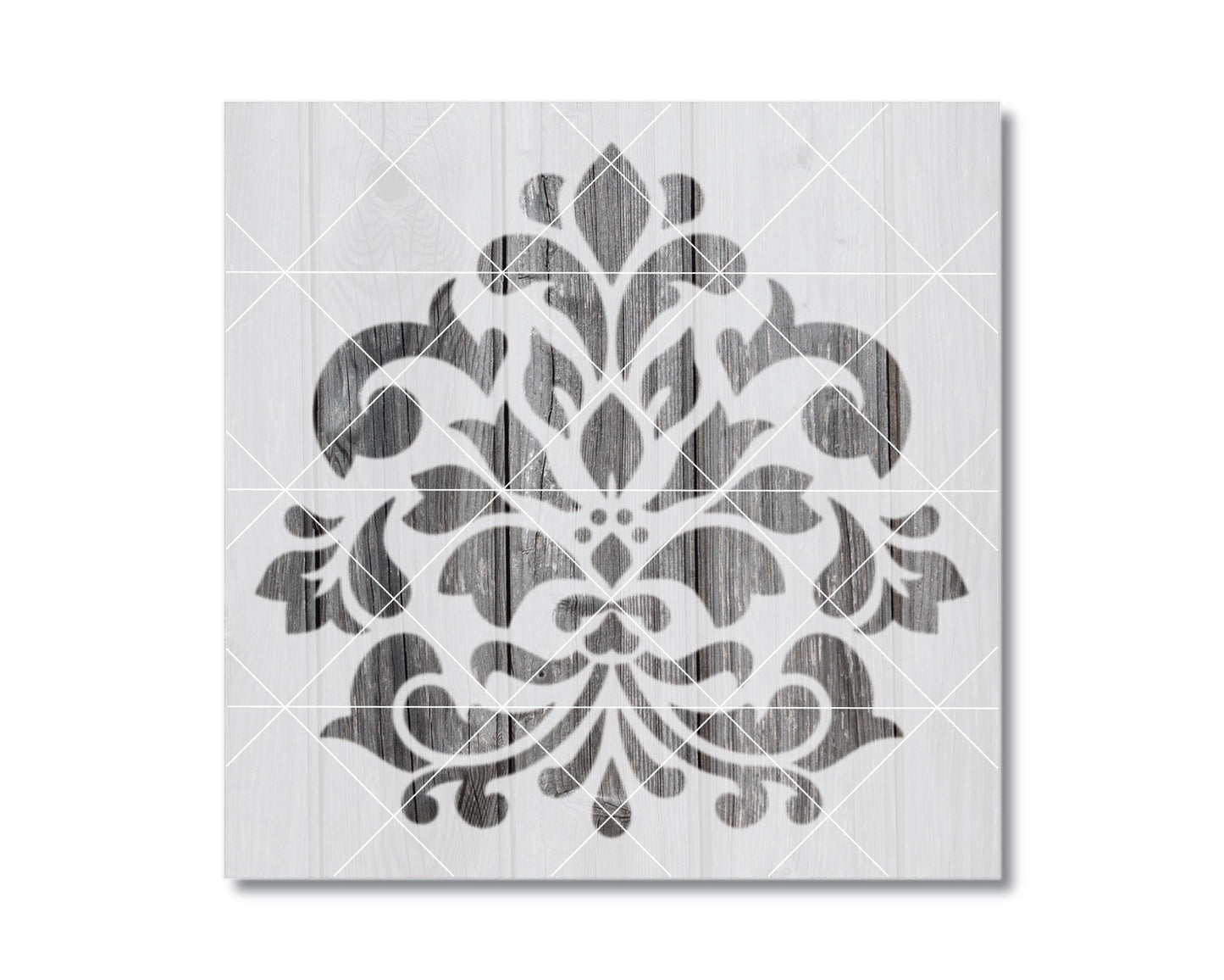 a square-shaped design with a repeating pattern of black and white floral and leaf-like shapes.