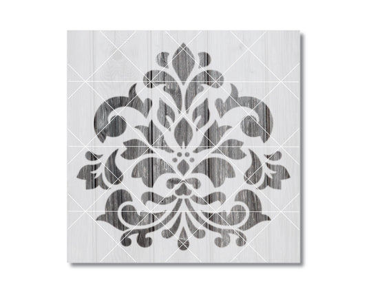 a square-shaped design with a repeating pattern of black and white floral and leaf-like shapes.
