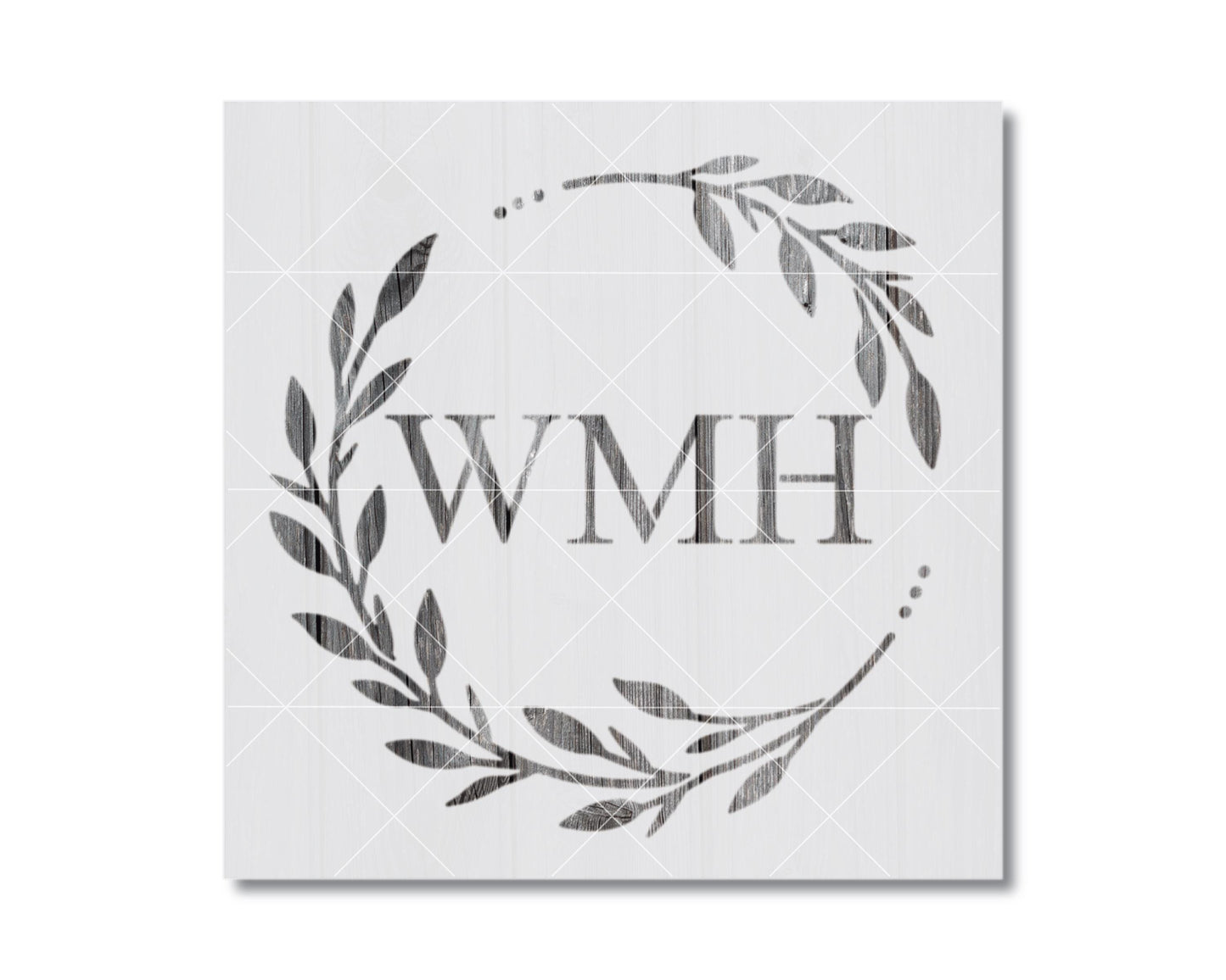 a wreath-like design with the letters "WMH" prominently displayed in the center.